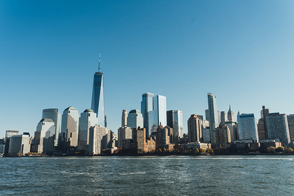 city building near body of water under blue.jpg